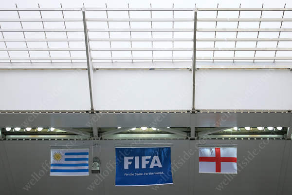 Flags hang from the stadium roof