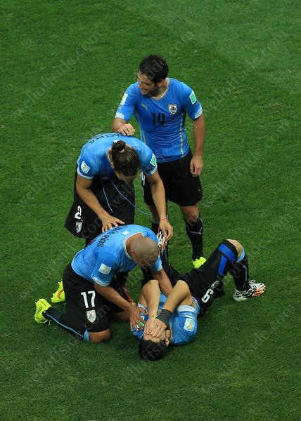 Luis Suarez collapses in an emotional heap as he celebrates his side's opener